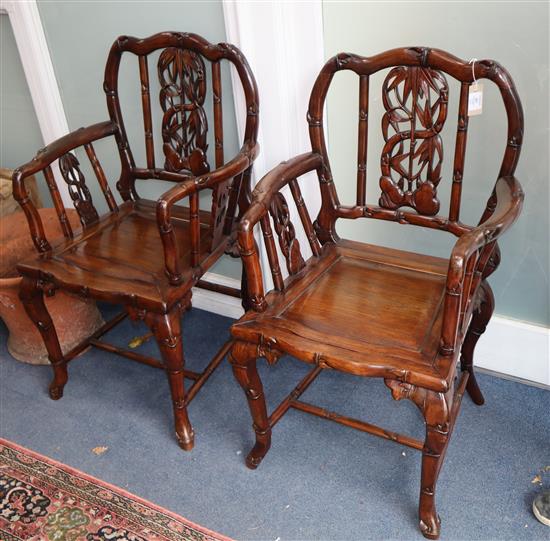 A pair of early 20th century Chinese Hongmu elbow chairs